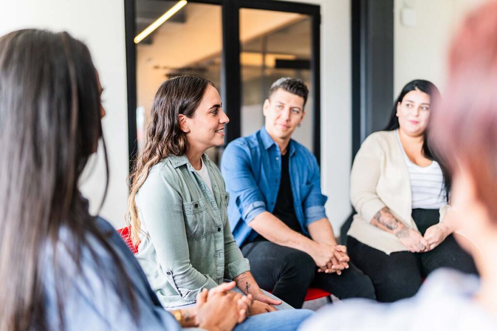 a woman speaks in a support group