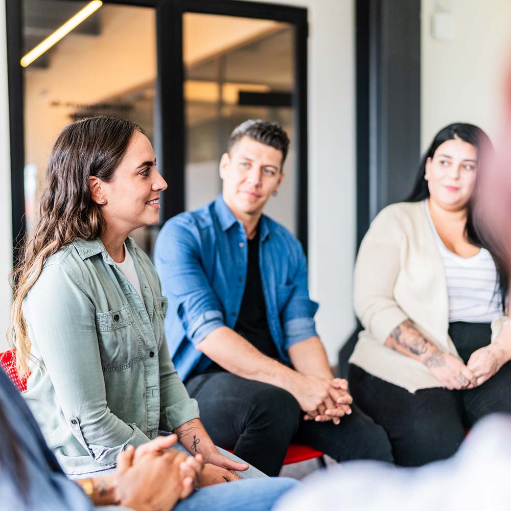 a woman speaks in a support group